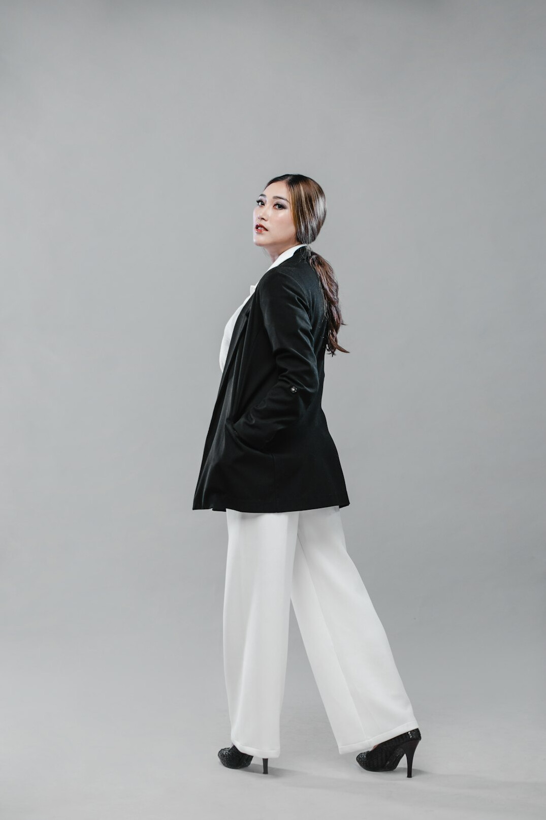 Studio portrait of a young Malaysian Malay woman in business casual attire