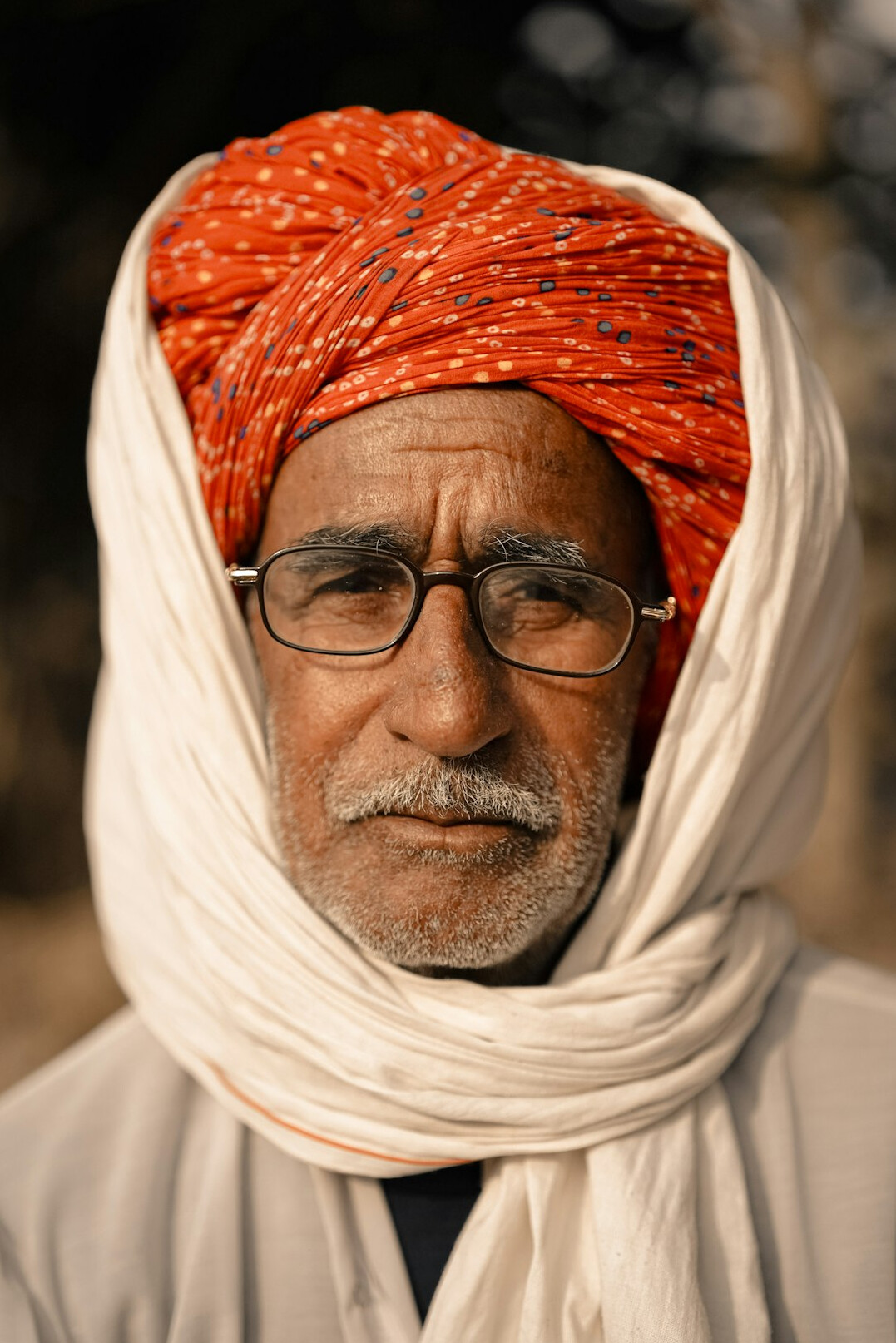Studio portrait of a Malaysian Indian man in business casual attire