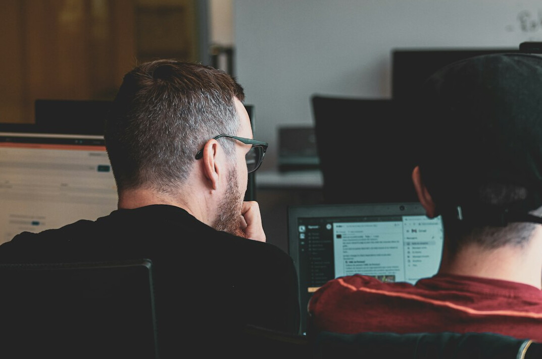software developers coding together